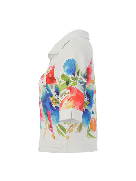 White jacket with colourful floral design on a white background.