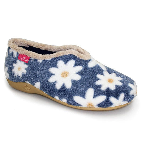 A single slip-on fleece slipper in navy blue with a white daisy floral pattern, featuring a beige fuzzy collar and a tan sole, shown on a white background.