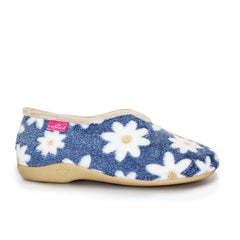 A single slip-on fleece house shoe in navy blue with a white daisy floral pattern, featuring a beige sole and a pink brand tag on the side.