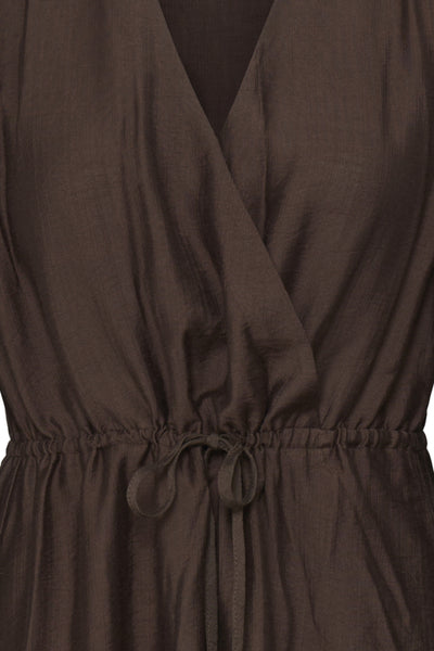 Close-up of a dark brown wrap-style dress with a drawstring waist and V-neckline.