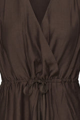 Close-up of a dark brown wrap-style dress with a drawstring waist and V-neckline.