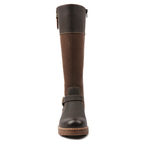A knee-high leather boot shown from the front on a plain white background. The boot features a dark brown leather upper and sole, with a medium brown textured panel on the shaft and a dark brown strap with a buckle around the ankle.