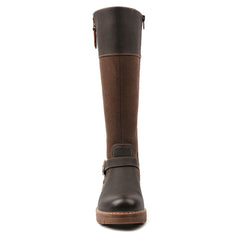 A knee-high leather boot shown from the front on a plain white background. The boot features a dark brown leather upper and sole, with a medium brown textured panel on the shaft and a dark brown strap with a buckle around the ankle.