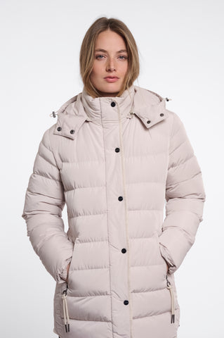A woman shown from the back wearing a light beige padded coat and dark brown wide-leg trousers against a plain white studio background.