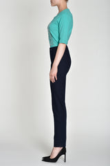 Side profile of model wearing Robell Marie Navy Jeans with side ankle splits.