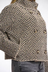 Herringbone patterned rino pelle jacket with buttons on a plain background