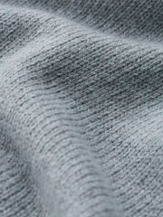 Close up of Seasalt light blue ribbed knit fabric texture with soft folds.
