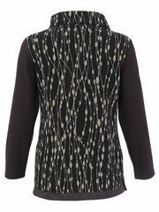 A women's Dolcezza long-sleeve knit top shown from the back, featuring a black base with a beige vertical dotted line pattern and solid dark brown sleeves.