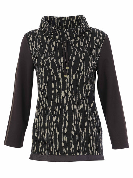 A women's long-sleeve Dolcezza Sweater with a high mock neck, featuring a black and beige vertical dotted pattern on the body and solid black sleeves.