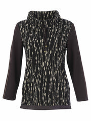A women's long-sleeve Dolcezza Sweater with a high mock neck, featuring a black and beige vertical dotted pattern on the body and solid black sleeves.