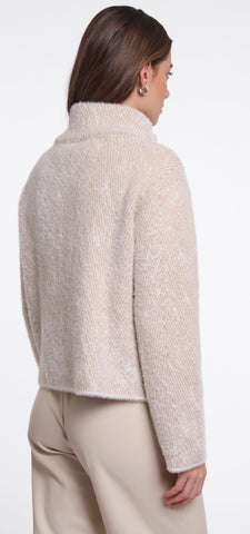 Close up of a textured cream coloured woven fabric with four off-white buttons arranged in a grid.