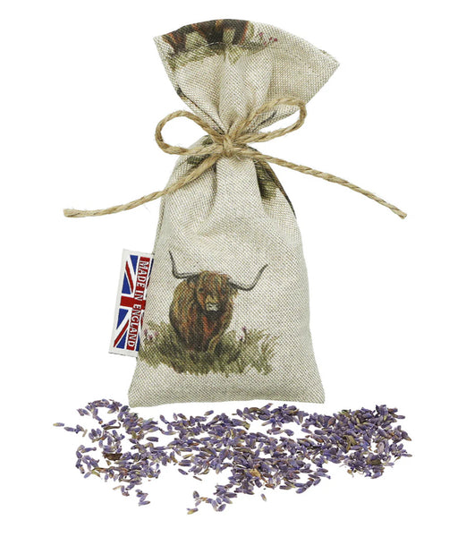The Wheat Bag Company Lavender Herbal drawstring bag with a Scottish highland cow design and lavender flowers.