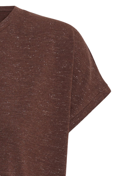 Close-up of a brown t-shirt on a white background