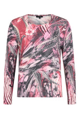 Sunday long sleeve, round neck Top. In an abstract pattern in red colours. Against a white studio background.