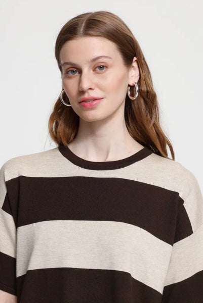 A woman wearing an Ichi  crew neck with wide horizontal stripes in dark brown and cream.