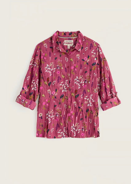 Seasalt pink floral long-sleeve button-up shirt with a textured crinkle fabric, laid flat against a light beige background.