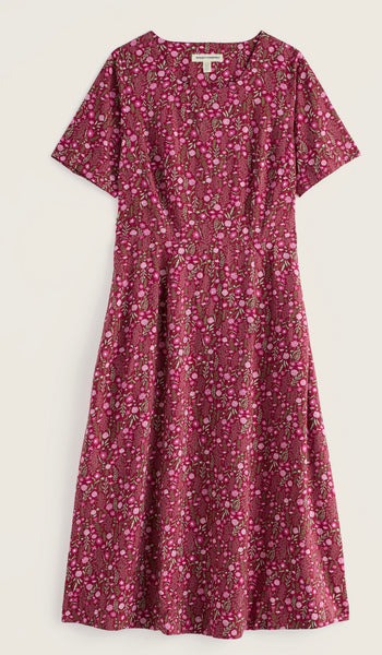 Seasalt short sleeve A-line dress with a dense pink, red, and white floral print, displayed flat against a light off-white background.