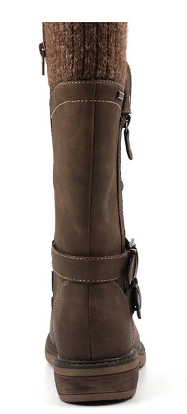 A taupe brown long boot with a knit sock-like collar, side zippers, and a buckle strap near the ankle, shown against a plain white background.