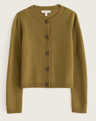 Close up of Seasalt ribbed knit fabric in a muted olive-brown tone with a single round button on the front.