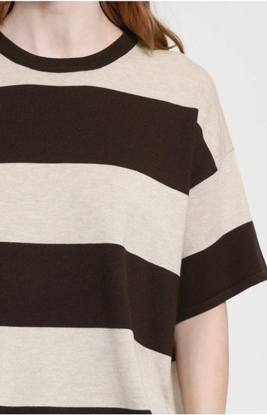 A close up of a person wearing an oversized short sleeve Ichi top with wide horizontal stripes in dark brown and cream.