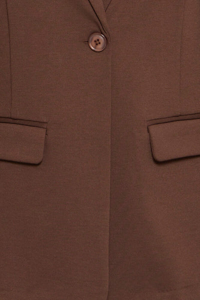 Close-up of Ichi brown blazer showing the chest area with a single button closure and two flap pockets.