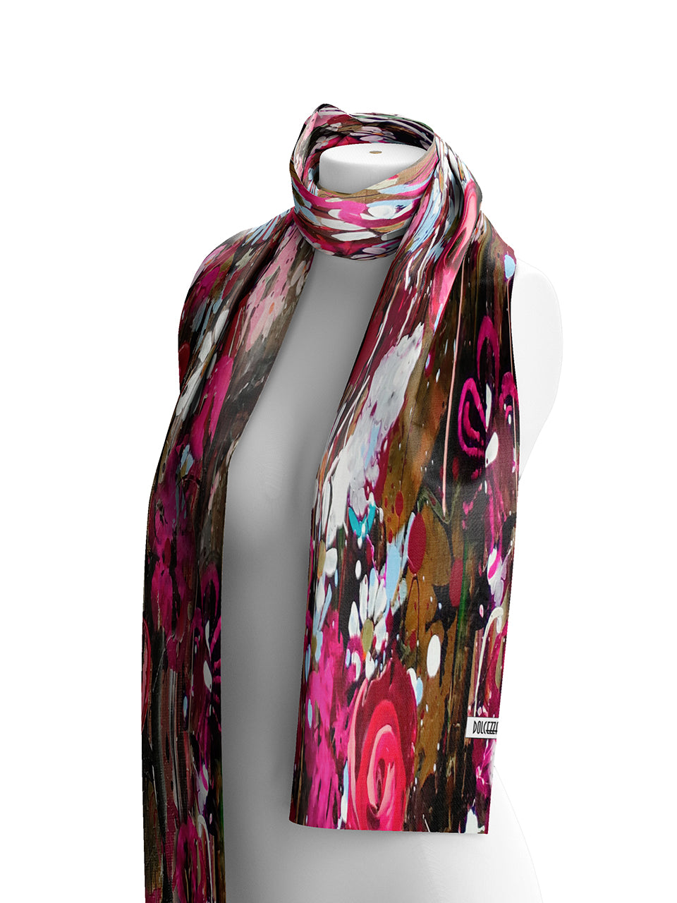 Dolcezza lightweight scarf with an abstract, painterly print in vibrant pink, brown, white, and black, draped on a white mannequin torso against a plain white background.