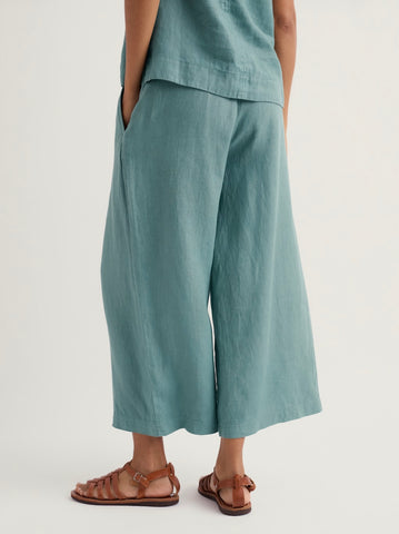 Close-up of teal fabric with an elastic waistband.
