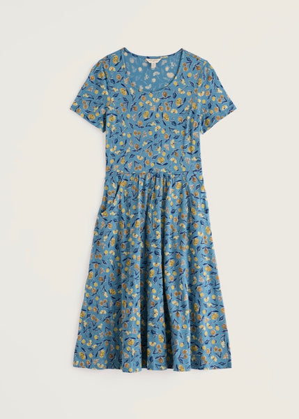 Seasalt short sleeve round neck dress with a blue, yellow, and white floral print, displayed flat against a light beige background.