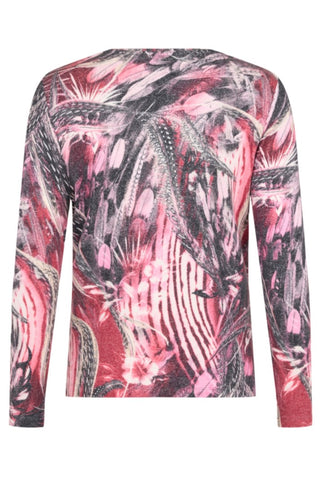 Back profile of a long-sleeve round neck top featuring an abstract, painterly pattern in pink, red, black, and white, shown against a plain white background.