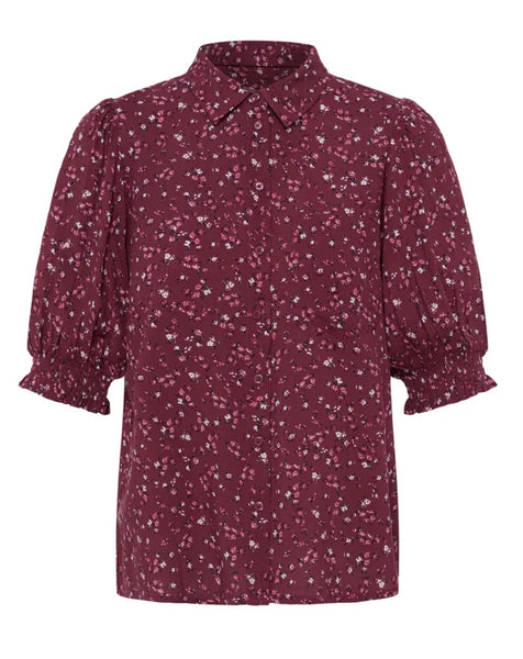 A women's short-sleeve button-up Ichi shirt in a burgundy with a white and light pink floral print, featuring puffed elbow-length sleeves and a pointed collar.