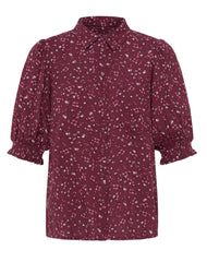A women's short-sleeve button-up Ichi shirt in a burgundy with a white and light pink floral print, featuring puffed elbow-length sleeves and a pointed collar.