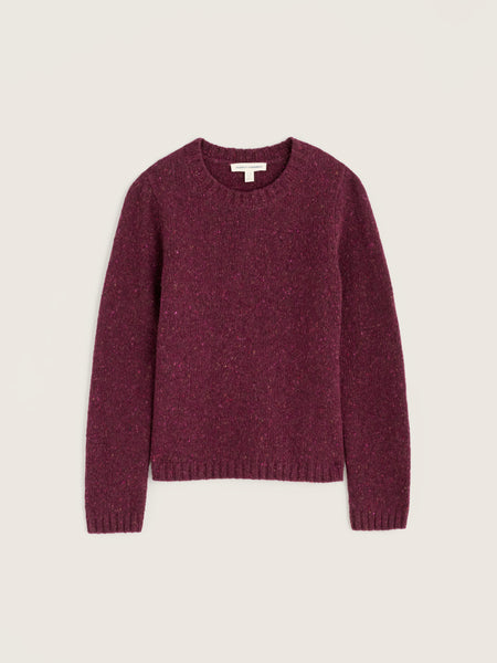 A maroon Seasalt crewneck knit sweater with a textured, heathered finish, displayed flat against a light beige background.