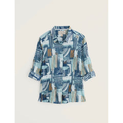 Blue patterned shirt on a light beige background.