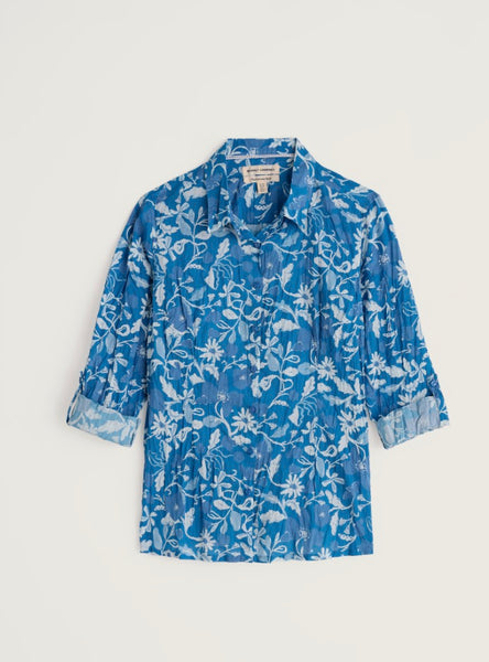 Blue floral patterned shirt on a light grey background.
