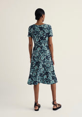 Woman wearing a floral dress on a white background