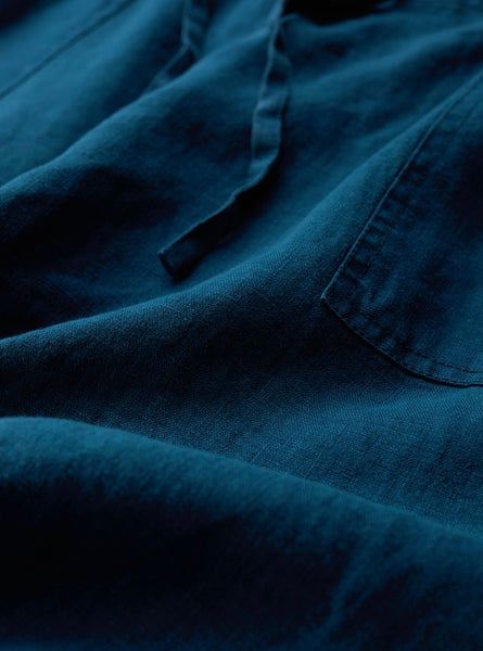 Close-up of blue fabric with visible texture.