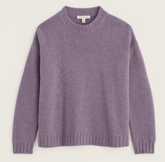 Seasalt lavender purple knit crewneck sweater with ribbed cuffs and hem, displayed flat against a light cream background.