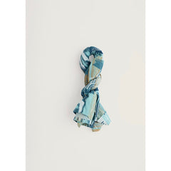 Blue patterned scarf on a light grey background.