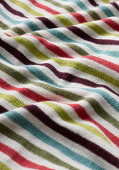 Close-up of colourful striped fabric with red, green, blue, and brown patterns.