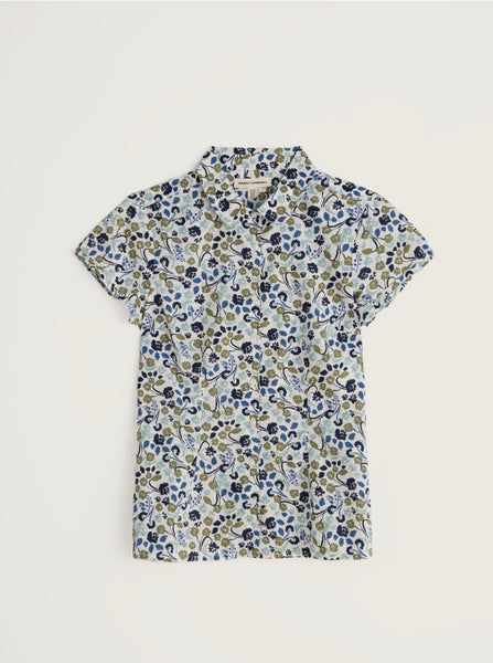 Floral patterned shirt on a light grey background.