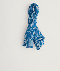 Blue floral patterned scarf on a white background.
