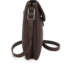 Side profile of brown handbag with strap on white background 
