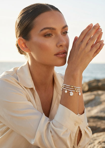 Women’s wrap round charm design bracelet in silver colour by Envy Jewellery at our Lincolnshire Boutique 