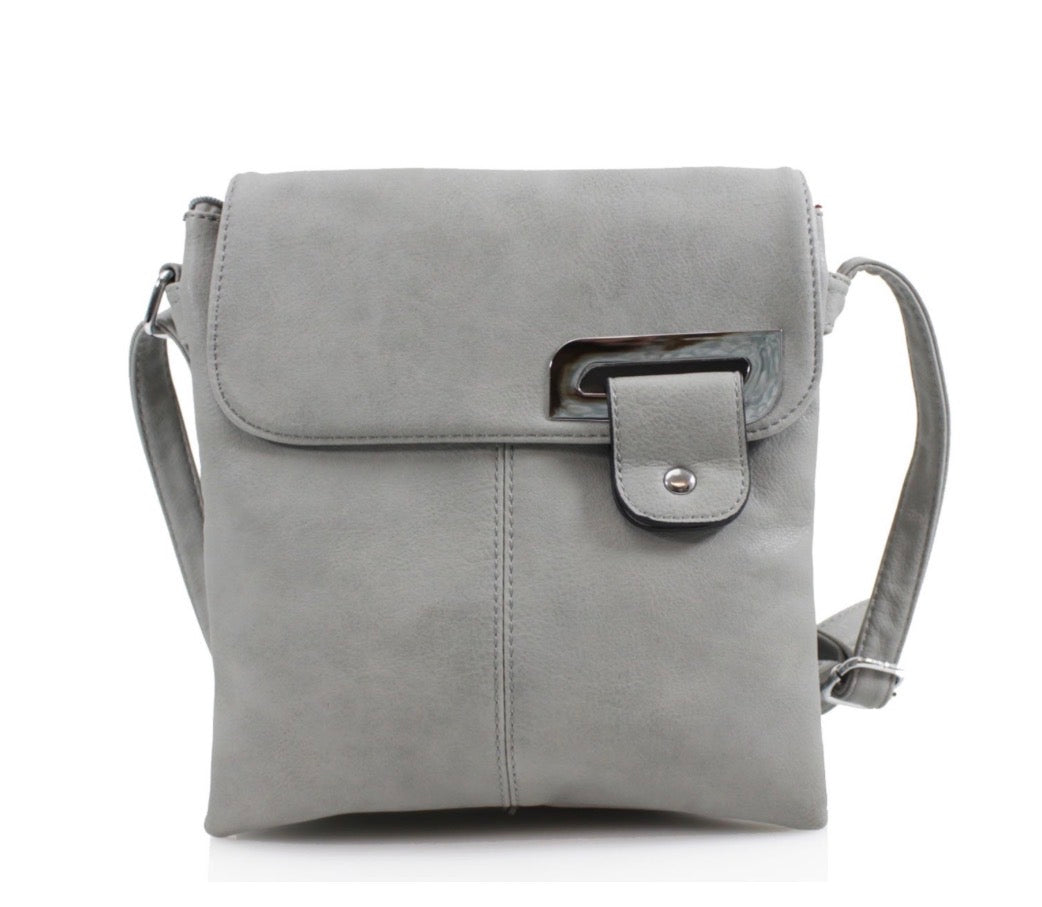 Light grey crossbody bag with adjustable strap magnet fastener and zip. Displayed on a white background. 