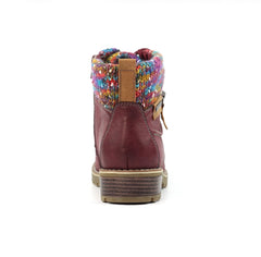 A single ankle boot shown from the back on a white background, featuring a burgundy leather upper, a colorful knit cuff with a rainbow pattern, and a brown sole.