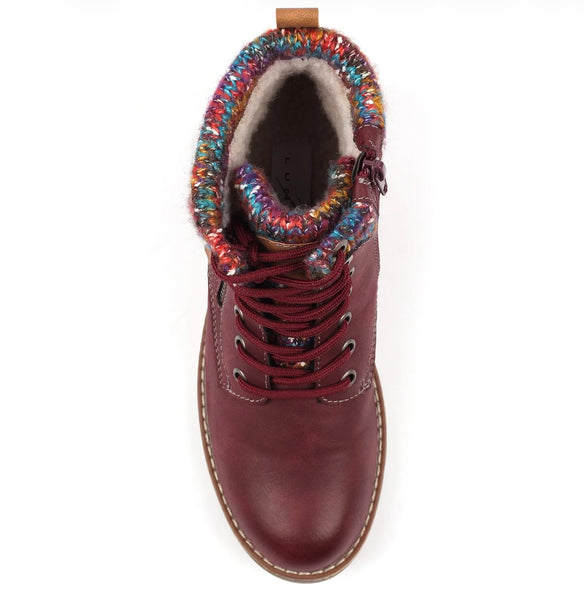 A top-down view of a burgundy leather lace-up ankle boot with a vibrant multicolor knit cuff and a light beige fleece lining, shown on a white background.