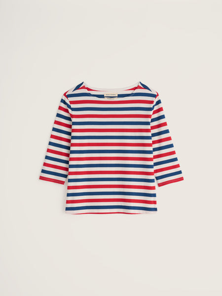 Red, white, and blue striped long-sleeve shirt on a light beige background.