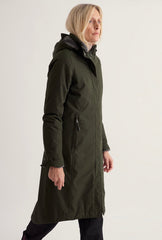 A woman modeling a long olive green hooded parka coat, shown in profile against a plain light gray studio background.