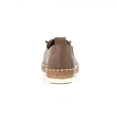 A single brown leather lace-up shoe shown from the back, featuring a cork-wrapped midsole and a white outsole, set against a plain white background.